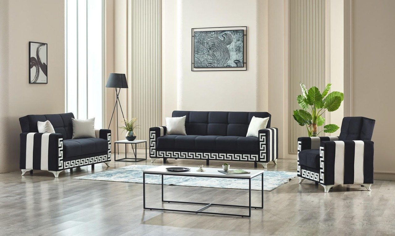 Modern living room with black-and-white Greek key patterned furniture and abstract art.