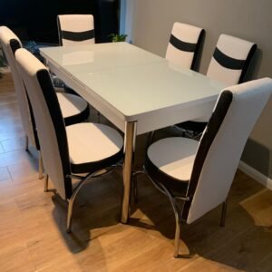 ClearSpan Dining Set with a white table and six white and black chairs.