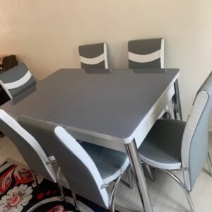 ClearSpan Dining Set with a gray table and six matching gray and white chairs in a modern dining room.