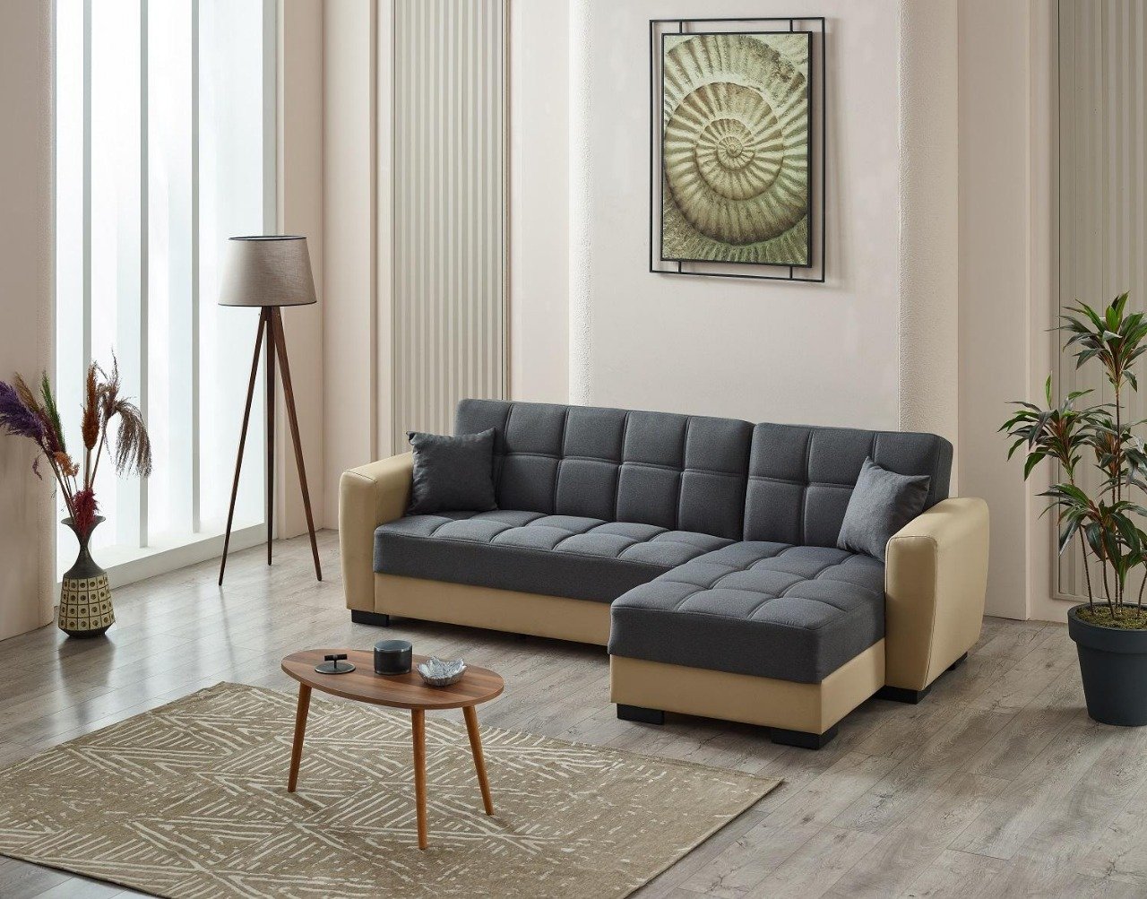 Modern living room with a grey sectional sofa, wooden table, and spiral shell artwork.