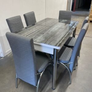 Dining set with a wood-patterned table and six gray upholstered chairs, known as the Infinity Design Dining Set.