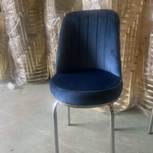 Majesta Chair with dark blue velvet upholstery and silver metal legs.