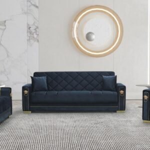 Dark blue sofa set with gold accents against a marble and light wall, with a decorative circular element above and a plant on the side.