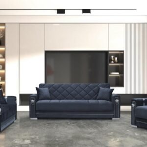 Modern living room with a large blue sofa, two matching armchairs, and a TV on a wall with shelves.