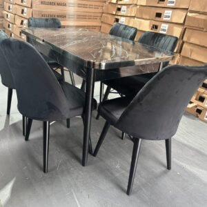 OakHaven Dining Set with a dark marbled table and six dark cushioned chairs in a warehouse setting.
