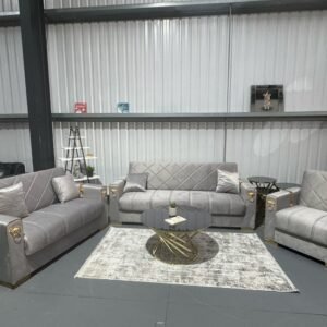 Orlena Sofa Bed with matching armchairs in a modern living room setting.