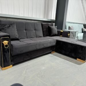 Black Sereno Corner Sofa with gold accents and tufted design.