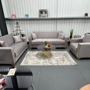 A set of Siena Sofa Bed furniture in light gray with gold accents, featuring a sofa, loveseat, and armchair.