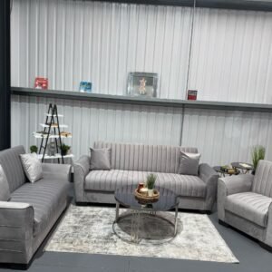 Siena Sofa Bed set in light gray upholstery with gold detailing, including a three-seater sofa, two-seater loveseat, and matching armchair.