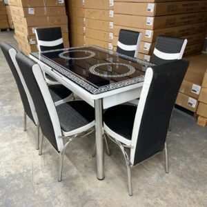 TrendEdge Dining Set with black and white chairs in a warehouse.