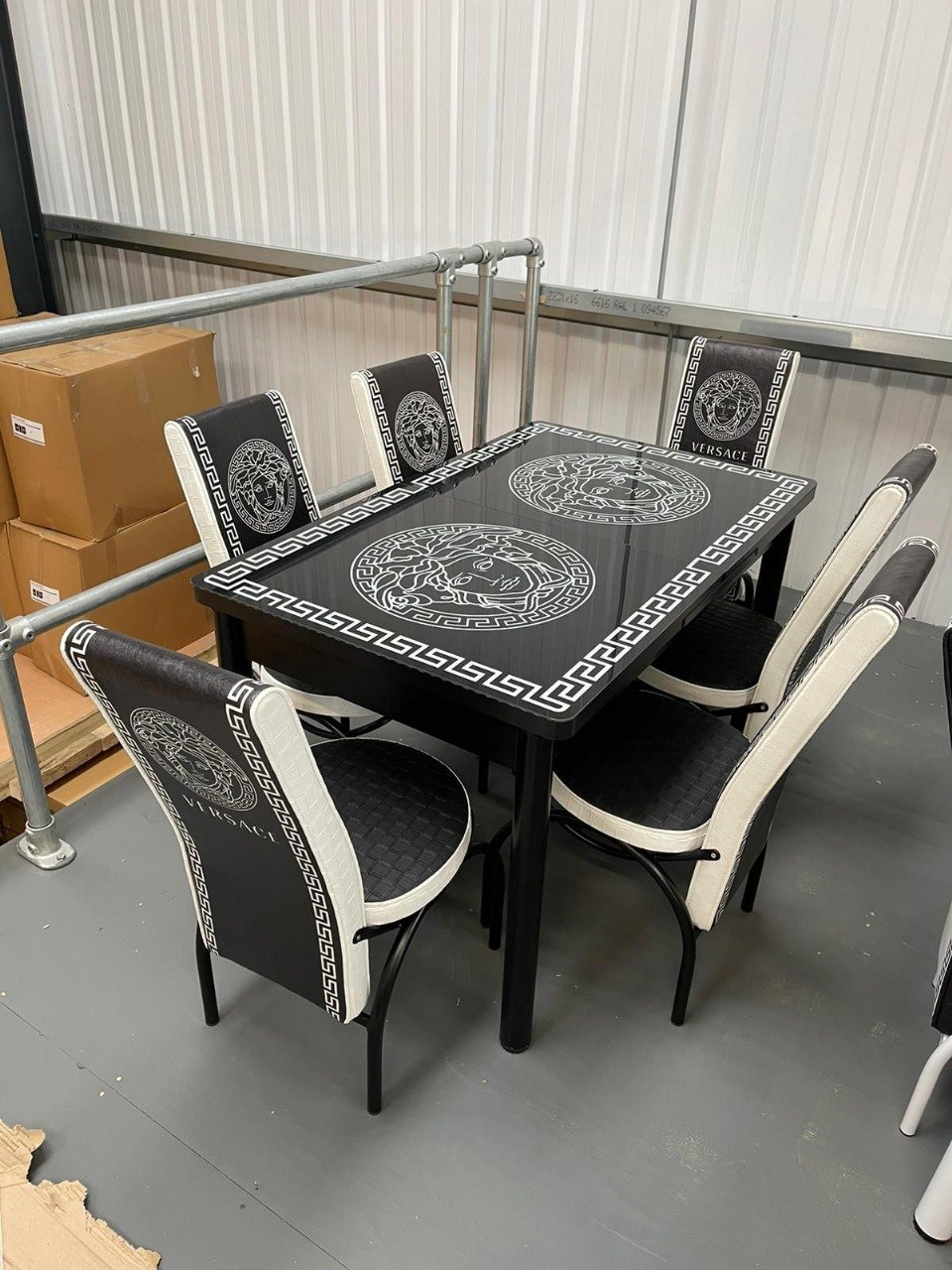 VogueLine Modern Dining set with black and white patterned table and chairs.