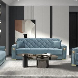 Modern living room with blue seating, gold accents, and a glass coffee table.